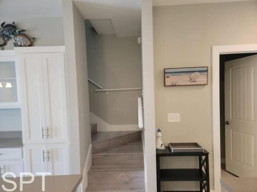 a hallway with a refrigerator in a house at Bungalow Tarvana-#1 in Port Isabel