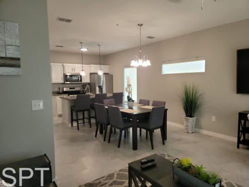 a dining room and living room with a table and chairs at Bungalow Tarvana-#1 in Port Isabel