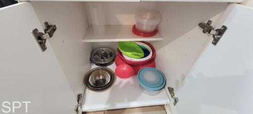 a drawer in a kitchen with some dishes in it at Gulfpoint 1302 in South Padre Island