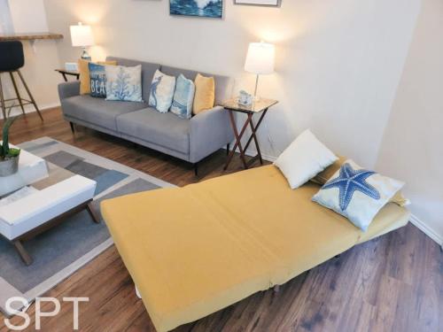 a living room with a couch and a couch and a table at Gulfpoint 1302 in South Padre Island