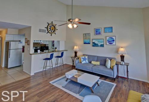 a living room with a couch and a table at Gulfpoint 1302 in South Padre Island