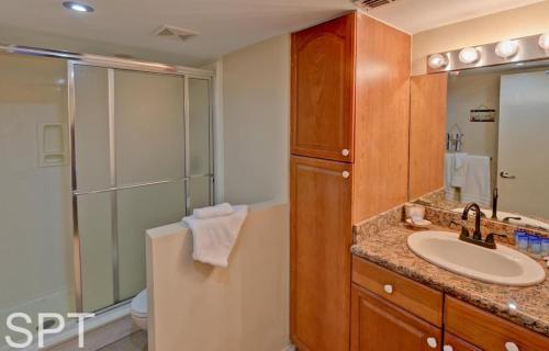 a bathroom with a sink and a shower at Gulfpoint 1302 in South Padre Island