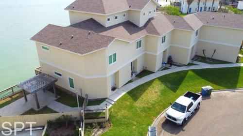 a white van parked in front of a large house at Bungalow Tarvana-#1 in Port Isabel