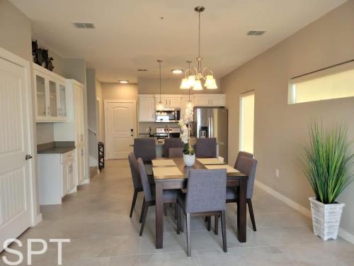 a dining room and kitchen with a table and chairs at Bungalow Tarvana-#1 in Port Isabel
