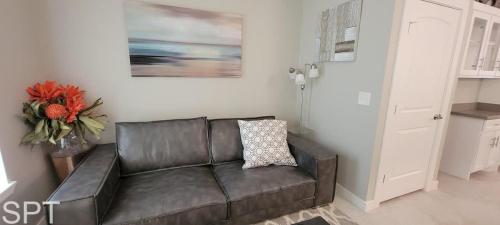 a brown leather couch in a living room at Bungalow Tarvana-#1 in Port Isabel