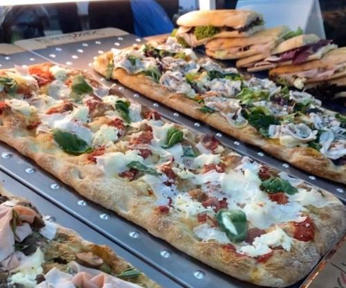 a group of pizzas sitting on top of a table at Borgo Albergo Museum XIV in Melfi