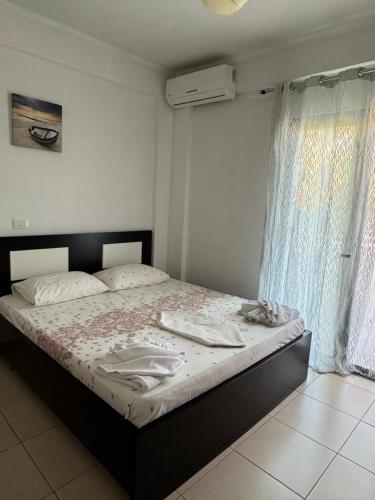a bedroom with a large bed with aintendent at Villa Festim Ksamil in Ksamil