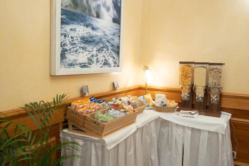 a table in a room with a white table cloth at Hotel Florida Lerici in Lerici