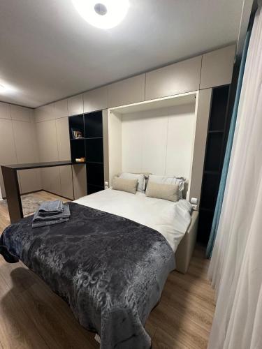a bedroom with a large bed in a room at Splendid view Sinaia in Sinaia