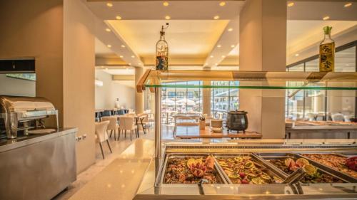 a buffet in a restaurant with many different foods at Selyria Resort in Tsilivi