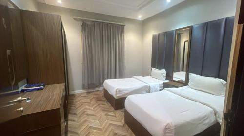 Postel nebo postele na pokoji v ubytování نزل رفا