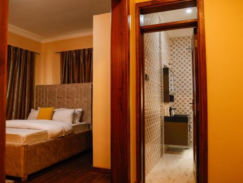 En eller flere senge i et værelse på Eco Safari House