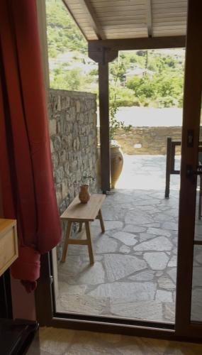 a view of a room with a table and a window at ANDRIANA Mountain Home - ASPRIAS 