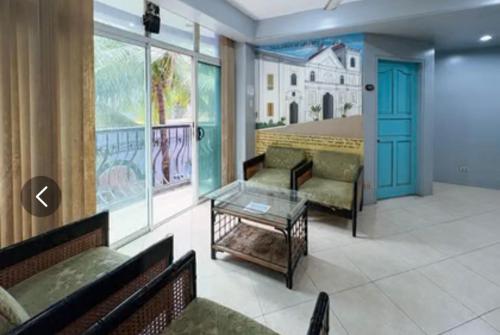 a waiting room with two couches and a table at Hotel Le Carmen in Cebu City