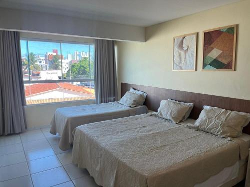 Postel nebo postele na pokoji v ubytování Hotel Bessa Atlântico