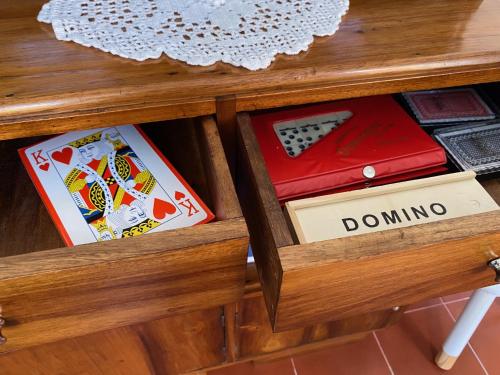 a drawer of a table with dominoes at Casa dos Castanheiros Angra do Heroismo in Terra Chã