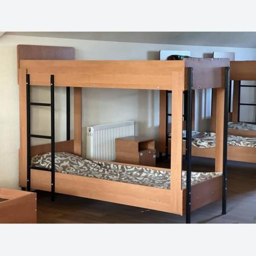 a set of bunk beds in a room at Хостел AUTOMAX in Dnipro