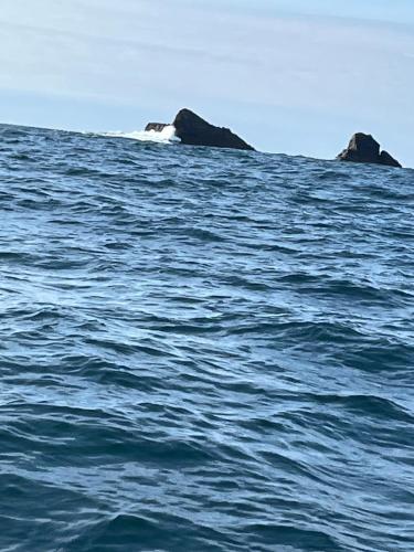 two rocks in the middle of a large body of water at Anchor’s Away in Letterkenny