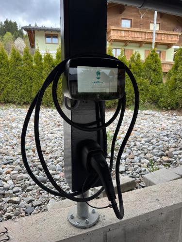 a pay phone with a cable attached to it at Luxury Chalet Mauthner Alm in Kötschach