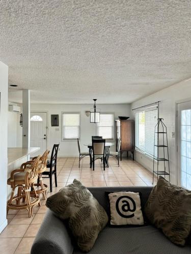 a living room with a couch and a table at Waterfront 2-BR Home in Providenciales in Providenciales