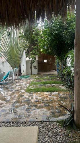 a patio with chairs and plants in a building at Aparthotel Saoco in Las Terrenas