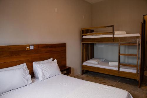 a bedroom with two beds and a bunk bed at Casa Naná - Suites in Prea