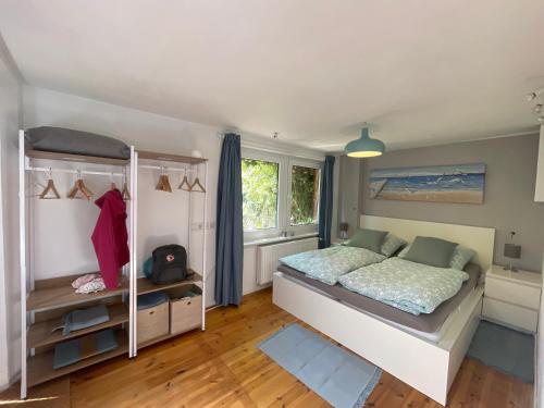a bedroom with a bed and a window at Ferienwohnung Storchennest Zwei in Dassow