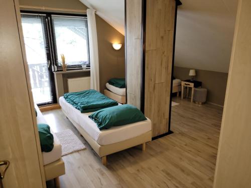 Ένα ή περισσότερα κρεβάτια σε δωμάτιο στο Familiehuis Dolve