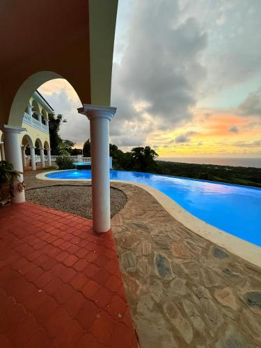 a view of a house with a swimming pool at El Castillo Tropical in Cabrera