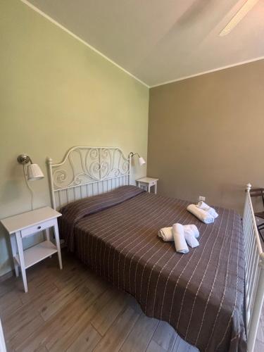 a bedroom with a bed with two pillows on it at Agriturismo Melona in Bolsena