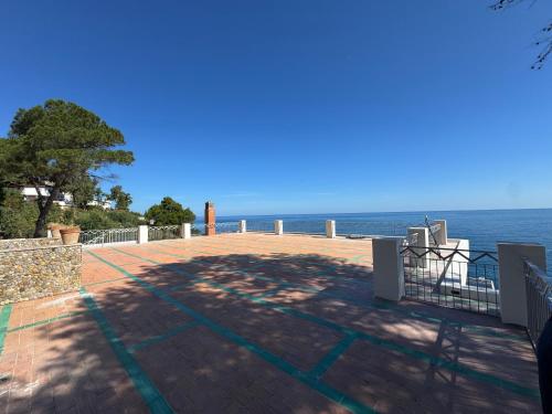 a patio with a view of the ocean at AWA Kafara in Porticello
