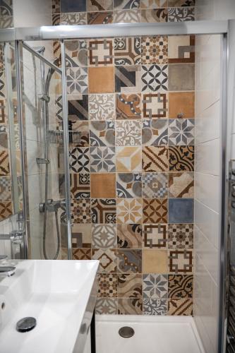 a bathroom with a shower and a sink at Casa San Carlo in Valletta