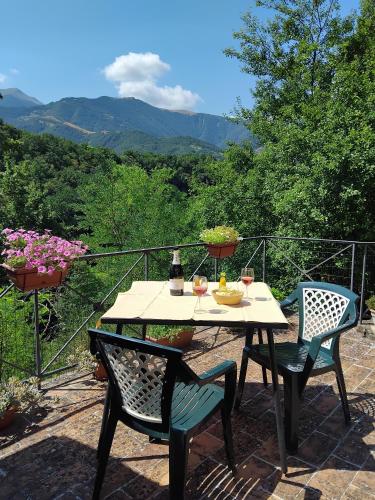a table and chairs on a patio with a view at Tre Archi in Grumale