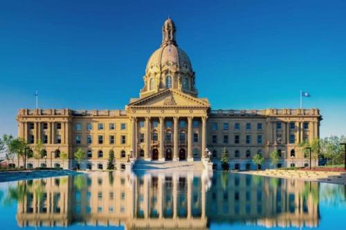 a building with a dome on top of it at 5BD Jungle Oasis - HotTub - BBQ - King Bed - Games - Garage in Edmonton