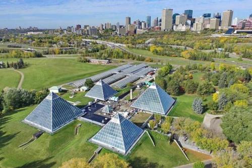 an overhead view of a building with blue roofs at 5BD Jungle Oasis - HotTub - BBQ - King Bed - Games - Garage in Edmonton