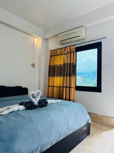 Ένα ή περισσότερα κρεβάτια σε δωμάτιο στο SABAIDEE hotel