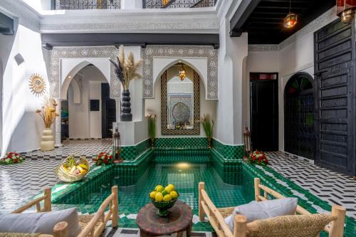 a pool in the middle of a building with a pool at Dar Bonita in Marrakech