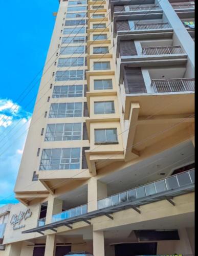 a tall building with balconies on the side of it at Sea View Condo with Balcony Near Ayala in Cebu City