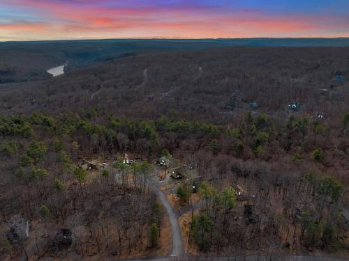 an aerial view of a house in the middle of a forest at Fall and Winter Forest Retreat Private Spa, Sauna & Ski in Lackawaxen