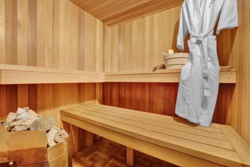 a sauna with a wooden bench in a room at Fall and Winter Forest Retreat Private Spa, Sauna & Ski in Lackawaxen