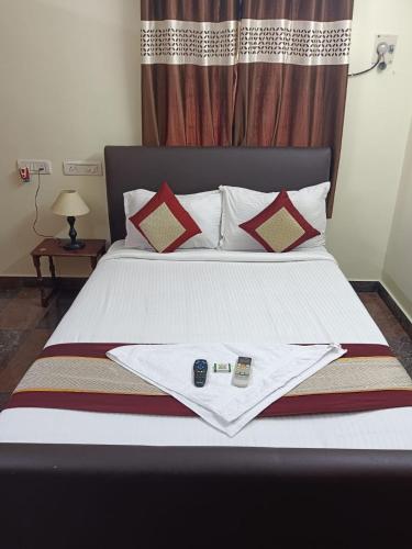 Ένα ή περισσότερα κρεβάτια σε δωμάτιο στο IRIS COMFORT INN BLOSSOM