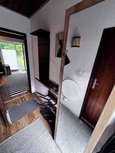 a bathroom with a mirror and a sink and a toilet at White Rabbit Apartment in Spital am Semmering