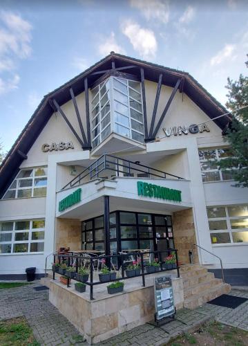 a building with plants in the front of it at Casa Vinga in Poiana Brasov