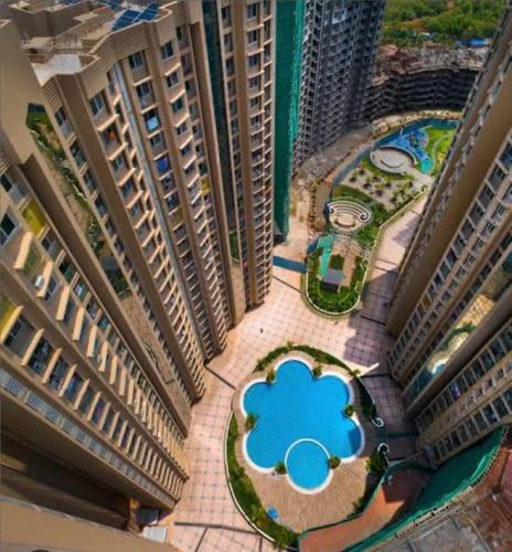 an aerial view of a building with a blue cloud at Airnest Stays- Bohemian in Mumbai