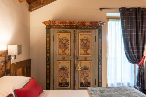 Una cama o camas en una habitación de L'Abri des Amis