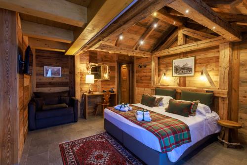 Una cama o camas en una habitación de L'Abri des Amis