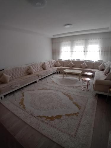 a living room with a couch and a rug at KilicHouse in Prizren