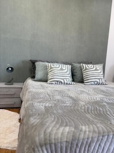 a bed with two pillows on it in a bedroom at Mary Apartment in Vercelli