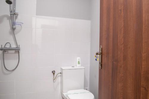 a bathroom with a toilet and a shower at ElStefanino House in Eforie Nord