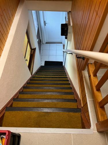 a view of a staircase in a building at Le Central - Chambres d'hôte in Grône